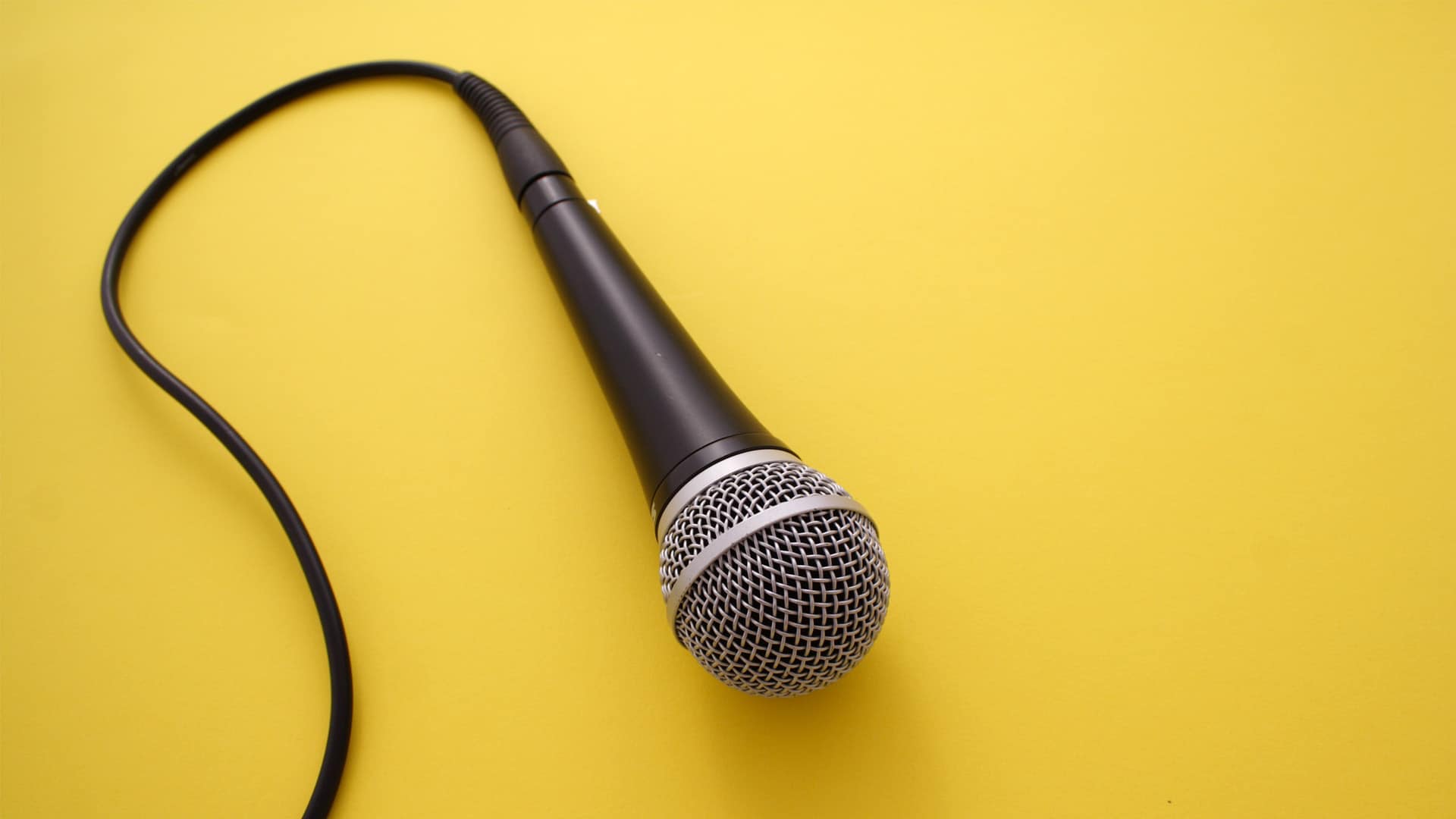 interview microphone on a yellow table